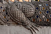 Chiang Mai - The Wat Chedi Luang, detail of the body of naga-makara guardian at the entrance of a secondary vihan. 